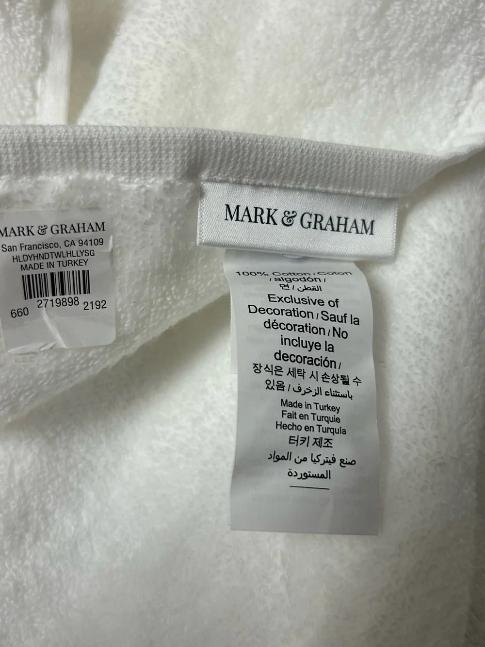 Mark & Graham Holly Holiday hand towel